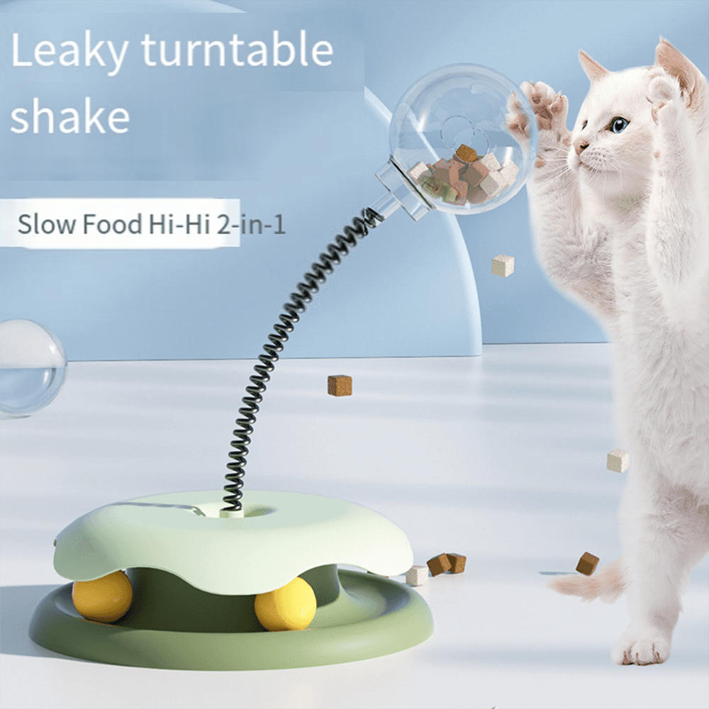Cat batting at Bevyn's interactive treat turntable toy